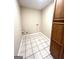 Clean laundry room with tile flooring, storage cabinet and hookups at 229 Timberland Trl, Riverdale, GA 30274