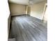Spacious living room featuring new gray flooring, neutral walls, and ample natural light at 229 Timberland Trl, Riverdale, GA 30274