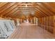Unfinished attic space with exposed rafters, subfloor and insulation, offering great potential at 3499 S Ola Rd, Locust Grove, GA 30248