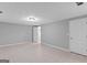Finished basement area with tile floors, neutral paint, and versatile layout for recreation at 3499 S Ola Rd, Locust Grove, GA 30248