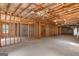 Large unfinished basement with concrete floor, exposed ceiling and framed walls ready for customization at 3499 S Ola Rd, Locust Grove, GA 30248