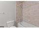 This bathroom is equipped with a toilet and a bathtub with a shower at 3499 S Ola Rd, Locust Grove, GA 30248