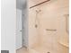 Accessible bathroom featuring a tiled shower with grab bars at 3499 S Ola Rd, Locust Grove, GA 30248