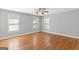Bright bedroom with hardwood floors and natural light from multiple windows at 3499 S Ola Rd, Locust Grove, GA 30248