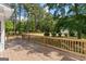 Large wooden deck offering a view of mature trees, perfect for enjoying the outdoors and entertaining at 3499 S Ola Rd, Locust Grove, GA 30248