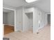 Hallway with cabinets and entrances to multiple rooms at 3499 S Ola Rd, Locust Grove, GA 30248