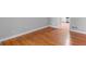 Close-up showcasing the pristine hardwood floors, neutral paint, and access to other rooms at 3499 S Ola Rd, Locust Grove, GA 30248