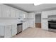 Well-lit kitchen featuring white cabinetry, stainless steel appliances, and tile flooring at 3499 S Ola Rd, Locust Grove, GA 30248
