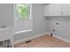 Laundry room with storage cabinets and a window at 3499 S Ola Rd, Locust Grove, GA 30248