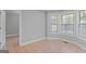 Living room featuring tan tile flooring and lots of natural light at 3499 S Ola Rd, Locust Grove, GA 30248