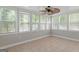 Sunroom features plenty of windows and a ceiling fan at 3499 S Ola Rd, Locust Grove, GA 30248