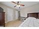 Comfortable bedroom with a ceiling fan, desk, and ample space at 1704 New Hope Rd, Locust Grove, GA 30248