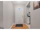 Inviting entryway features hardwood floors, a hall, and a charming welcome mat at 1704 New Hope Rd, Locust Grove, GA 30248