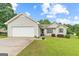 Charming one-story home with vinyl siding, attached garage, and a well-maintained lawn and landscaping at 1704 New Hope Rd, Locust Grove, GA 30248