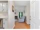 View from the doorway to a cozy living room with fireplace, hardwood floors, and comfortable seating at 1704 New Hope Rd, Locust Grove, GA 30248