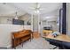 Bright and open living space with piano, workstation, and tile flooring at 1704 New Hope Rd, Locust Grove, GA 30248