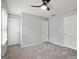 This bedroom features neutral walls and carpeting and multiple closets at 1823 Devon Sw Dr, Atlanta, GA 30311