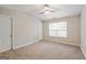 Bedroom featuring a ceiling fan and large window with natural light at 1823 Devon Sw Dr, Atlanta, GA 30311