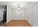 Bright dining room with wood floors, a modern chandelier, and plenty of space at 1823 Devon Sw Dr, Atlanta, GA 30311