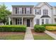 Charming townhome featuring a welcoming porch, well-maintained landscaping, and a classic, inviting facade at 1823 Devon Sw Dr, Atlanta, GA 30311