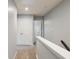 Upstairs hallway features carpeted floors and neutral paint at 1823 Devon Sw Dr, Atlanta, GA 30311
