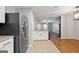 Well-lit kitchen featuring stainless steel refrigerator and tile flooring at 1823 Devon Sw Dr, Atlanta, GA 30311