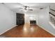 Bright living area with ceiling fan, fireplace, stairs, and opening to kitchen with great flow at 1823 Devon Sw Dr, Atlanta, GA 30311