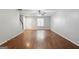 Inviting living area featuring hardwood floors, ceiling fan, staircase, and ample natural light at 1823 Devon Sw Dr, Atlanta, GA 30311
