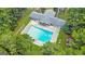 Aerial view of the community pool area, showcasing the large pool, lounge chairs, and surrounding landscaping at 2058 Sewanee Ct, Villa Rica, GA 30180