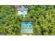 Aerial view of a community recreational area, featuring a swimming pool, basketball court, and pickleball courts at 2058 Sewanee Ct, Villa Rica, GA 30180