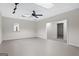 An open basement features a ceiling fan with lights and an open doorway at 2058 Sewanee Ct, Villa Rica, GA 30180