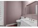 Cozy powder room with white vanity, modern fixtures, and neutral decor at 2058 Sewanee Ct, Villa Rica, GA 30180