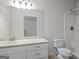 Bathroom with a single sink, toilet, and shower/tub combo at 2058 Sewanee Ct, Villa Rica, GA 30180