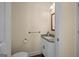 Compact powder room featuring a granite countertop and classic fixtures at 2058 Sewanee Ct, Villa Rica, GA 30180