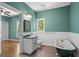 Relaxing bathroom with a clawfoot tub, separate toilet, and vanity area at 2058 Sewanee Ct, Villa Rica, GA 30180