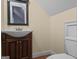 A charming bathroom features a sink, vanity, and toilet with wood flooring at 2058 Sewanee Ct, Villa Rica, GA 30180