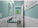 Charming bathroom with a vanity, toilet, and window for natural light and ventilation at 2058 Sewanee Ct, Villa Rica, GA 30180