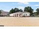 Beach house on the sandy shore, offering a relaxing spot to unwind and enjoy the lake views at 2058 Sewanee Ct, Villa Rica, GA 30180