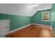 Bright bedroom with hardwood floors and a window providing natural light at 2058 Sewanee Ct, Villa Rica, GA 30180