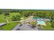 Aerial view of the community clubhouse featuring a pool, tennis courts, golf course, and parking at 2058 Sewanee Ct, Villa Rica, GA 30180