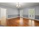 Bright dining room with hardwood floors, white trim and plantation shutters at 2058 Sewanee Ct, Villa Rica, GA 30180