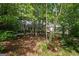 Exterior front view of the home framed by mature trees and landscaping at 2058 Sewanee Ct, Villa Rica, GA 30180