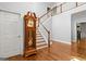 Inviting foyer showcases gleaming hardwood floors and grand staircase with white banister at 2058 Sewanee Ct, Villa Rica, GA 30180
