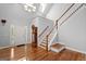 Spacious foyer with hardwood floors, chandelier, staircase, and grandfather clock at 2058 Sewanee Ct, Villa Rica, GA 30180