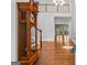 Elegant foyer with hardwood floors, an antique grandfather clock, and an open staircase at 2058 Sewanee Ct, Villa Rica, GA 30180