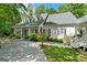 Charming home featuring a covered front porch, dormer windows, and a circular driveway at 2058 Sewanee Ct, Villa Rica, GA 30180