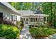 Charming home with manicured lawn, flowering shrubs, and covered front porch at 2058 Sewanee Ct, Villa Rica, GA 30180