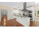 Bright kitchen featuring stainless steel appliances, hardwood floors and white cabinetry at 2058 Sewanee Ct, Villa Rica, GA 30180