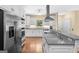 Modern kitchen featuring stainless steel appliances, custom cabinets, and granite countertops at 2058 Sewanee Ct, Villa Rica, GA 30180