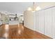 Spacious living room with hardwood floors, classic lighting and adjacent kitchen at 2058 Sewanee Ct, Villa Rica, GA 30180